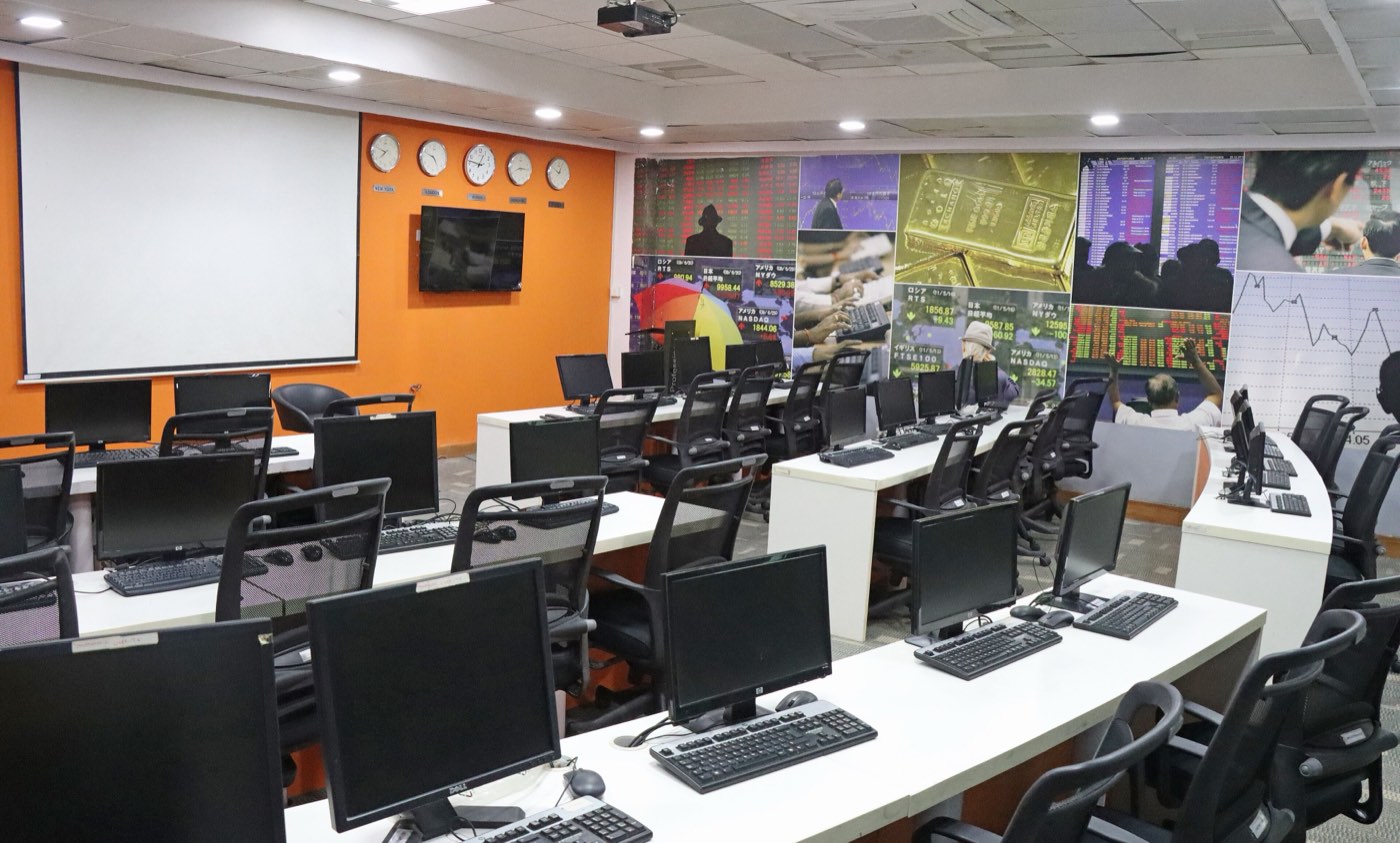 Traders and screens on a stock-exchange floor